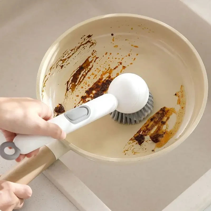 ROTATING LIQUID DISPENSING DISH BRUSH